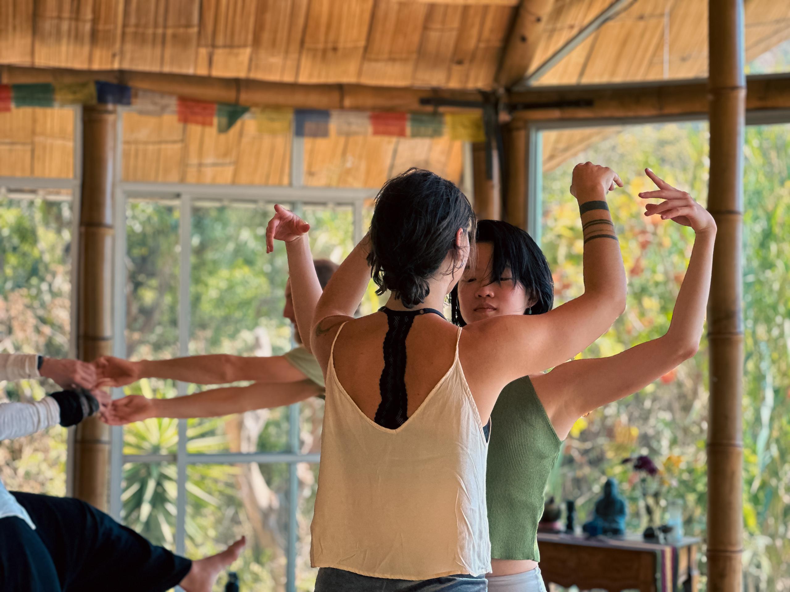 Two dancers in full connection during a Contact Beyond Contact workshop led by Laoproject